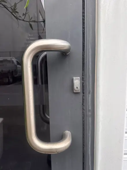 Commercial deadbolt cylinder replacement on a Brisbane glass door