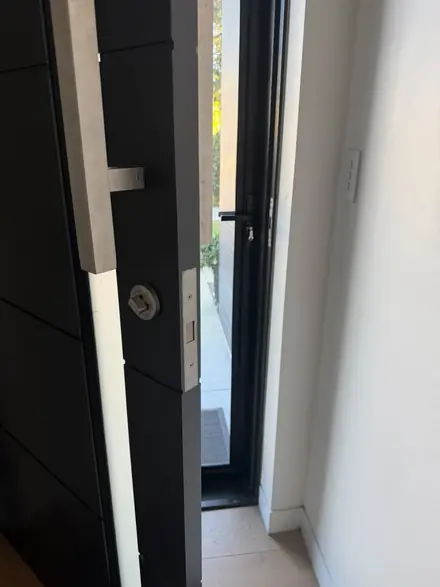 Mortice lock installation on a modern Brisbane front door